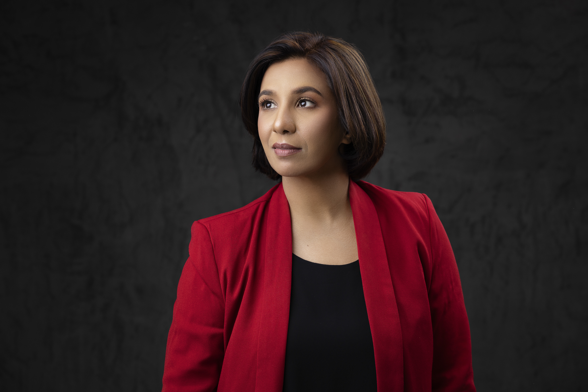 Professional business portrait of a woman in photography studio.