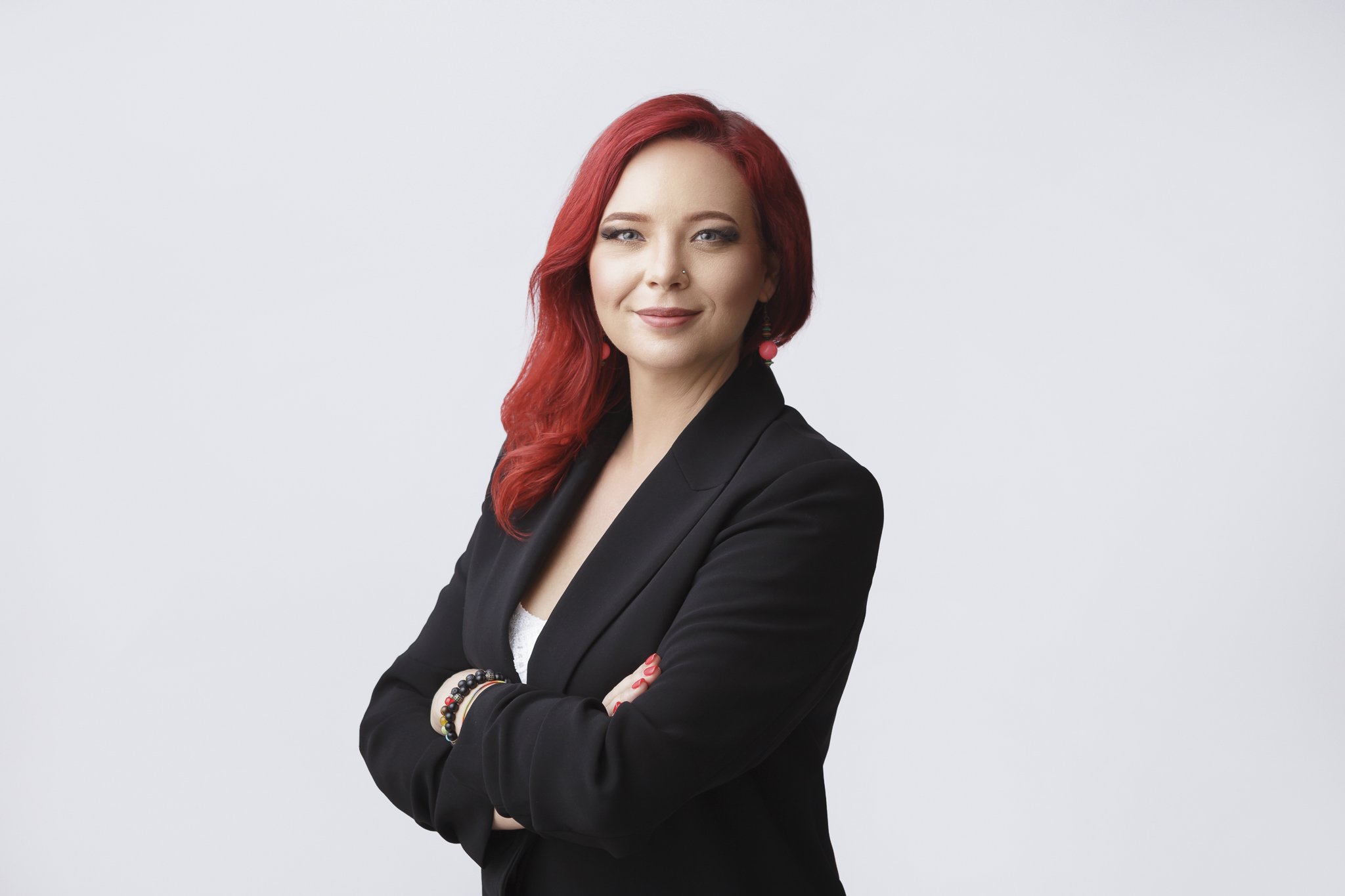 Businesswoman posing for her professional portrait in photography studio.