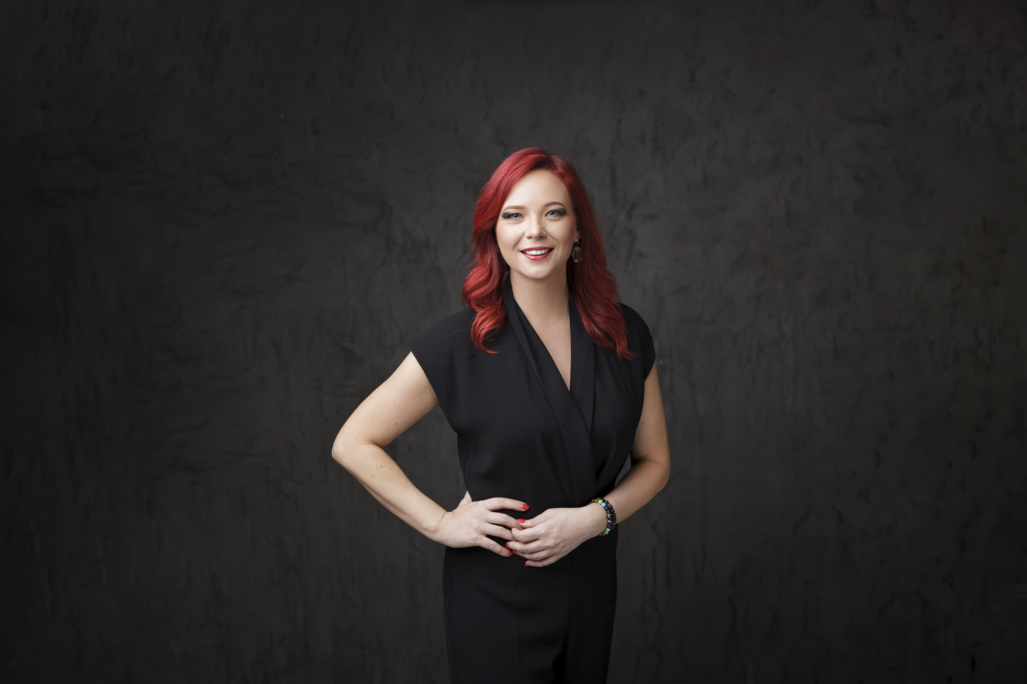 Businesswoman posing for her professional portrait in photography studio.