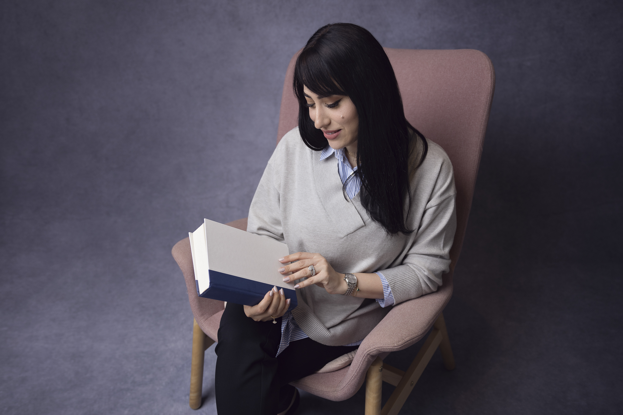 Professional photo of a writer holding her book.
